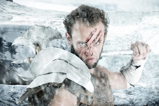 Ancient warrior or Gladiator posing outdoors with axe
