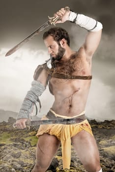 Ancient warrior or Gladiator posing outdoors with swords