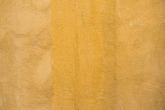 Close-up yellow concrete wall background. Old texture background.