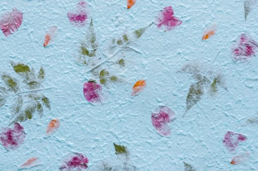 Blue mulberry paper with petal and leaf texture used for a background.