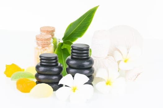 Tropical spa getaway with herbal compress balls, seashell shaped soaps, hot stones and bath salt