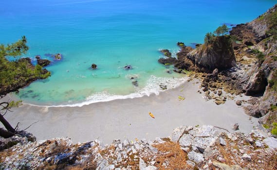 The yelllow canoe on the beach in Crozon Peninsula, Finistere, Brittany, France