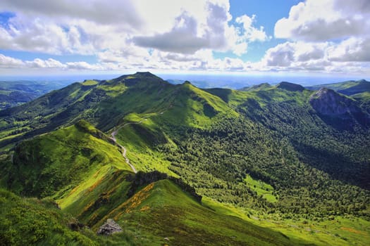 Panoramic landscape of volcanic mountains (view from Puy de Sancy, Massif Central, France)