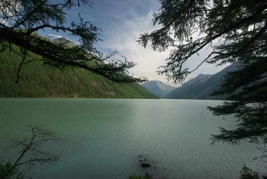Beautiful mountain landscape near the lake. Mountain Lake. Kind of mountainous terrain and the water in the valley.
