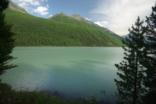 Beautiful mountain landscape near the lake. Mountain Lake. Kind of mountainous terrain and the water in the valley.