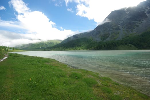 Mountain landscape. Highlands, the mountain peaks, gorges and valleys. The stones on the slopes.