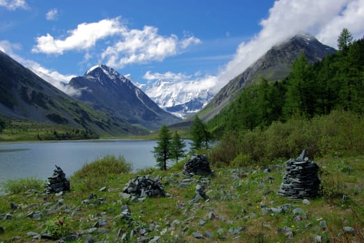 Mountain landscape. Highlands, the mountain peaks, gorges and valleys. The stones on the slopes.