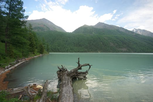 Beautiful mountain landscape near the lake. Mountain Lake. Kind of mountainous terrain and the water in the valley.