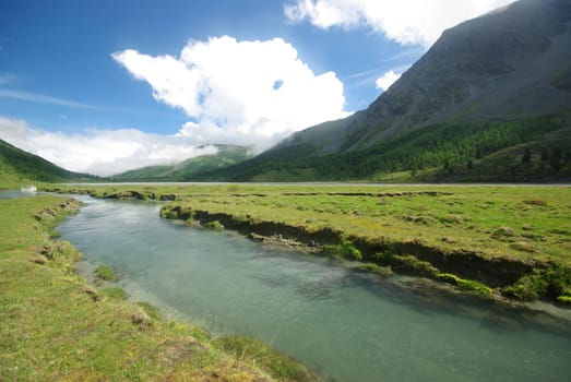 Mountain landscape. Highlands, the mountain peaks, gorges and valleys. The stones on the slopes.