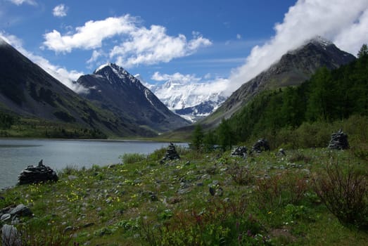 Mountain landscape. Highlands, the mountain peaks, gorges and valleys. The stones on the slopes.