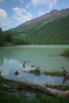 Beautiful mountain landscape near the lake. Mountain Lake. Kind of mountainous terrain and the water in the valley.