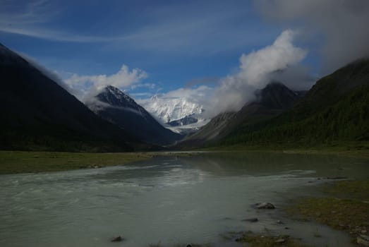 Mountain landscape. Highlands, the mountain peaks, gorges and valleys. The stones on the slopes.