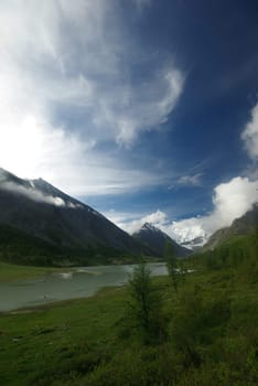 Mountain landscape. Highlands, the mountain peaks, gorges and valleys. The stones on the slopes.