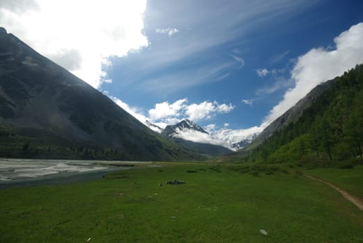 Mountain landscape. Highlands, the mountain peaks, gorges and valleys. The stones on the slopes.