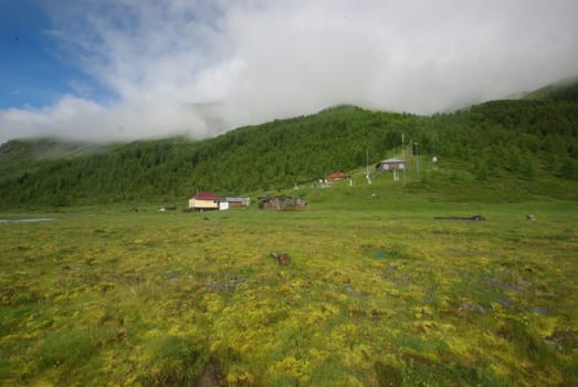 Mountain landscape. Highlands, the mountain peaks, gorges and valleys. The stones on the slopes.