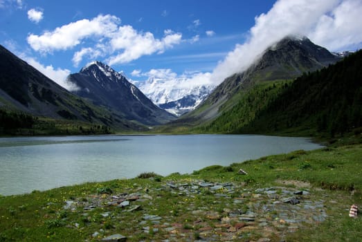 Mountain landscape. Highlands, the mountain peaks, gorges and valleys. The stones on the slopes.