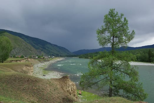 Mountain landscape. Highlands, the mountain peaks, gorges and valleys. The stones on the slopes.