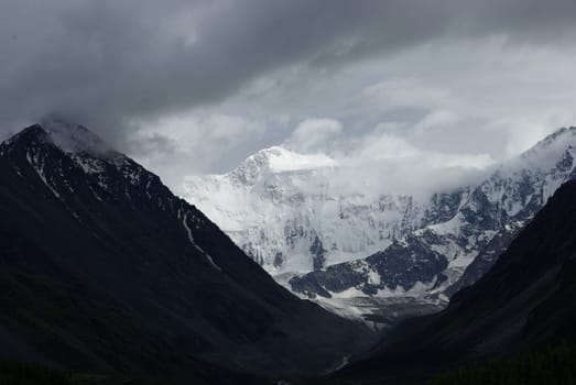 Mountain landscape. Highlands, the mountain peaks, gorges and valleys. The stones on the slopes.