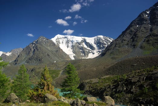Mountain landscape. Highlands, the mountain peaks, gorges and valleys. The stones on the slopes.