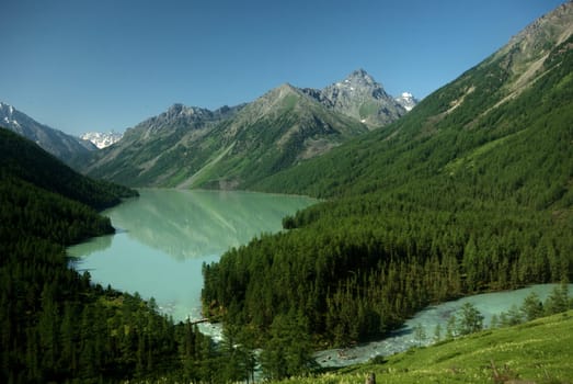 Mountain landscape. Highlands, the mountain peaks, gorges and valleys. The stones on the slopes.