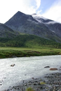 Mountain landscape. Highlands, the mountain peaks, gorges and valleys. The stones on the slopes.
