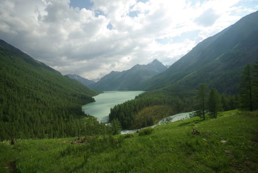 Mountain landscape. Highlands, the mountain peaks, gorges and valleys. The stones on the slopes.