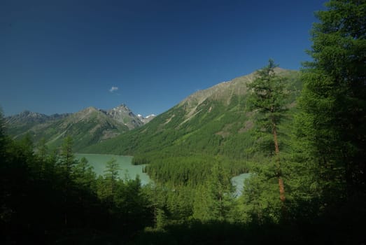 Mountain landscape. Highlands, the mountain peaks, gorges and valleys. The stones on the slopes.