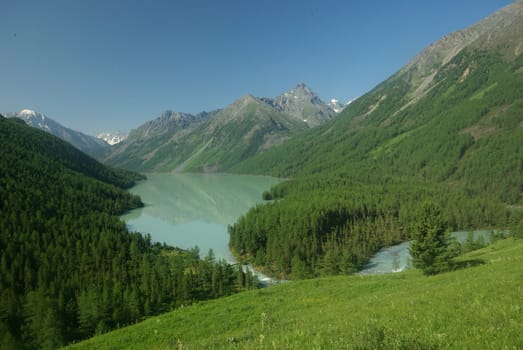 Mountain landscape. Highlands, the mountain peaks, gorges and valleys. The stones on the slopes.