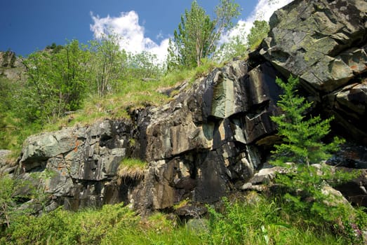 Mountain landscape. Highlands, the mountain peaks, gorges and valleys. The stones on the slopes.