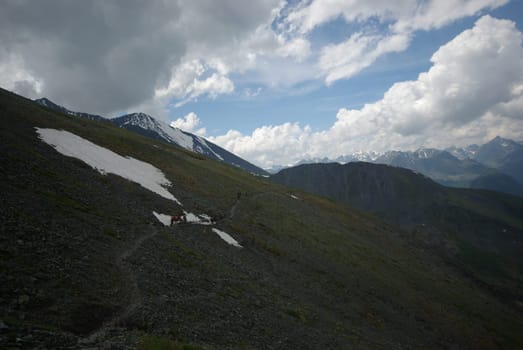 Mountain landscape. Highlands, the mountain peaks, gorges and valleys. The stones on the slopes.