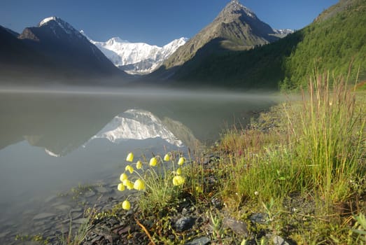 Beautiful mountain landscape near the lake. Mountain Lake. Kind of mountainous terrain and the water in the valley.