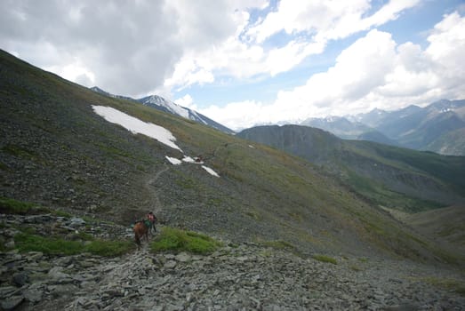 Mountain landscape. Highlands, the mountain peaks, gorges and valleys. The stones on the slopes.