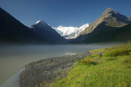 Beautiful mountain landscape near the lake. Mountain Lake. Kind of mountainous terrain and the water in the valley.