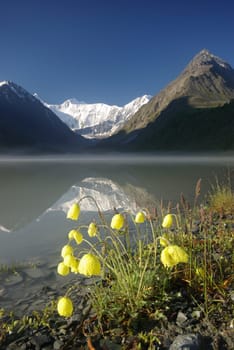 Beautiful mountain landscape near the lake. Mountain Lake. Kind of mountainous terrain and the water in the valley.