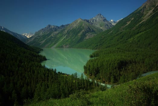 Mountain landscape. Highlands, the mountain peaks, gorges and valleys. The stones on the slopes.