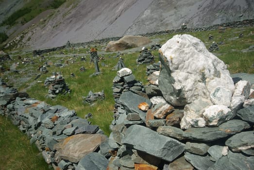 Mountain landscape. Highlands, the mountain peaks, gorges and valleys. The stones on the slopes.