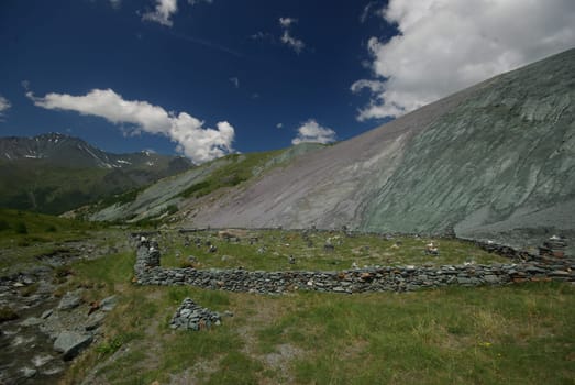 Mountain landscape. Highlands, the mountain peaks, gorges and valleys. The stones on the slopes.