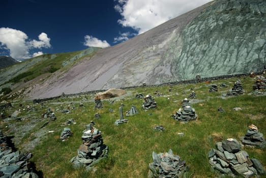 Mountain landscape. Highlands, the mountain peaks, gorges and valleys. The stones on the slopes.