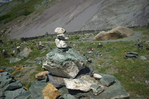 Mountain landscape. Highlands, the mountain peaks, gorges and valleys. The stones on the slopes.