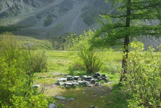 Mountain landscape. Highlands, the mountain peaks, gorges and valleys. The stones on the slopes.
