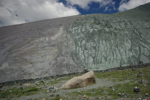 Mountain landscape. Highlands, the mountain peaks, gorges and valleys. The stones on the slopes.