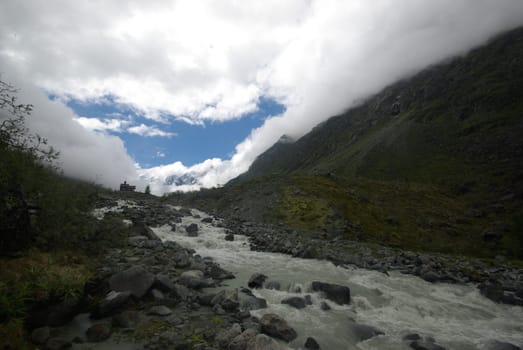Mountain landscape. Highlands, the mountain peaks, gorges and valleys. The stones on the slopes.