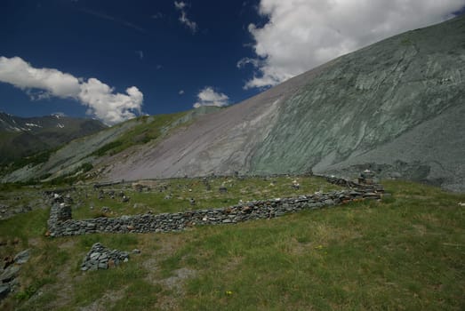 Mountain landscape. Highlands, the mountain peaks, gorges and valleys. The stones on the slopes.