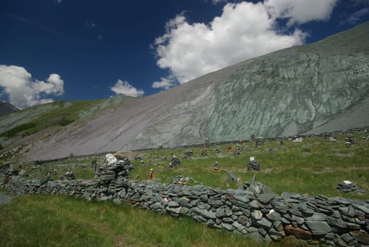 Mountain landscape. Highlands, the mountain peaks, gorges and valleys. The stones on the slopes.