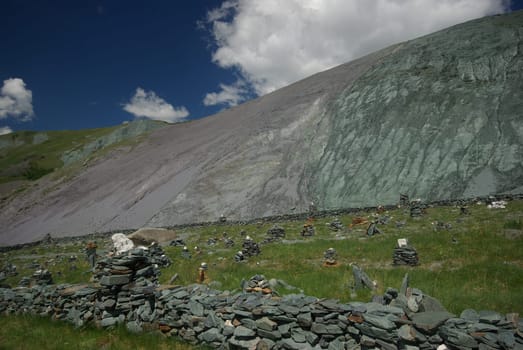 Mountain landscape. Highlands, the mountain peaks, gorges and valleys. The stones on the slopes.