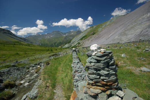 Mountain landscape. Highlands, the mountain peaks, gorges and valleys. The stones on the slopes.