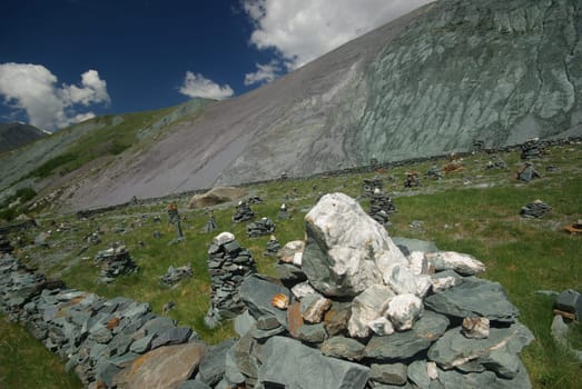 Mountain landscape. Highlands, the mountain peaks, gorges and valleys. The stones on the slopes.