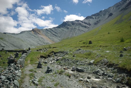 Mountain landscape. Highlands, the mountain peaks, gorges and valleys. The stones on the slopes.