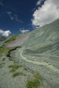 Mountain landscape. Highlands, the mountain peaks, gorges and valleys. The stones on the slopes.