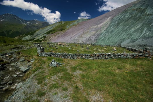 Mountain landscape. Highlands, the mountain peaks, gorges and valleys. The stones on the slopes.
